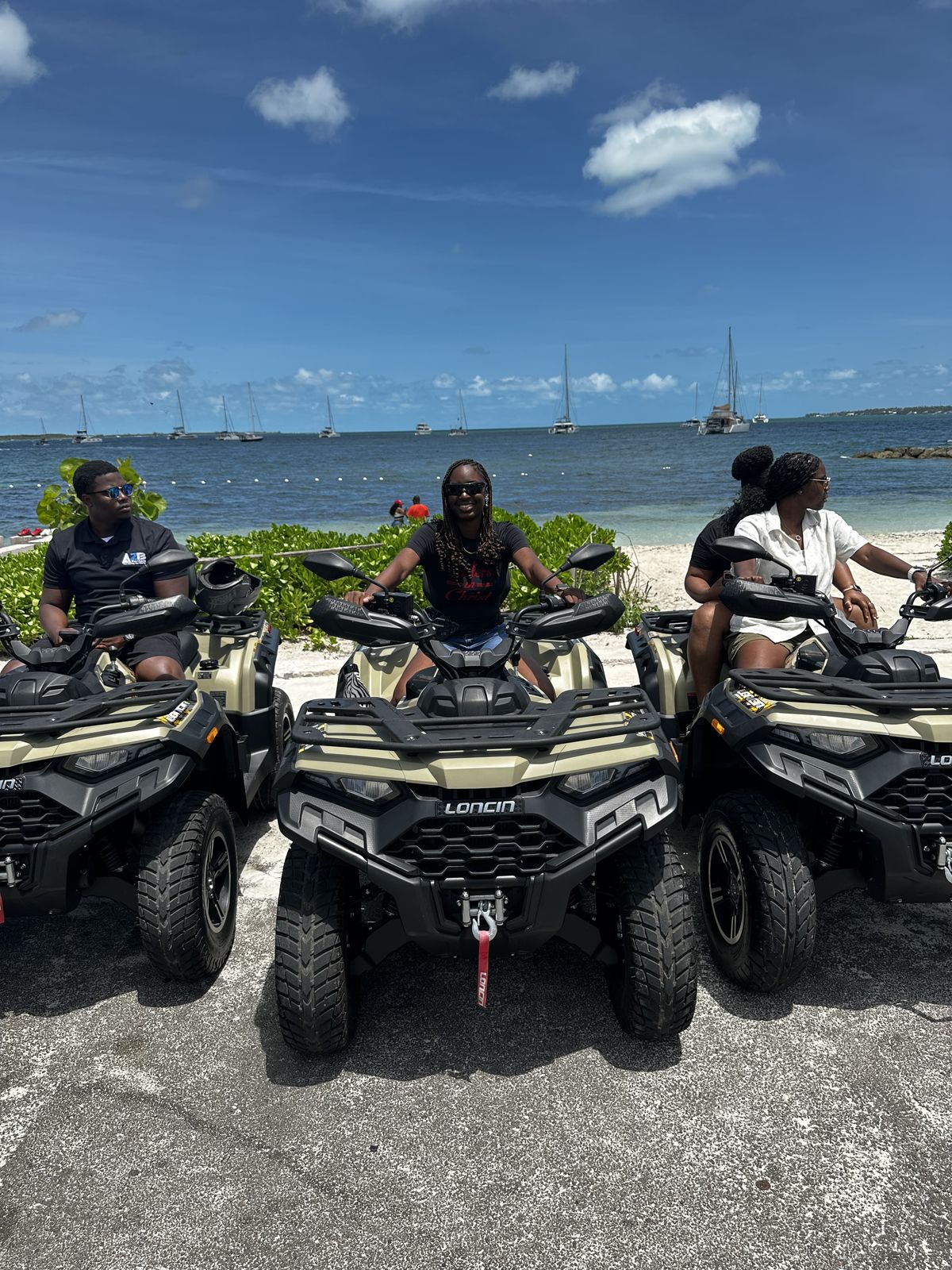 A2B Rentals ATV tour riders at the beach in Nassau, Bahamas