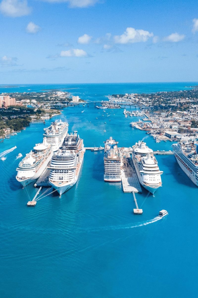 An aerial view of cruise ships docked at the Nassau cruise port in turquoise water